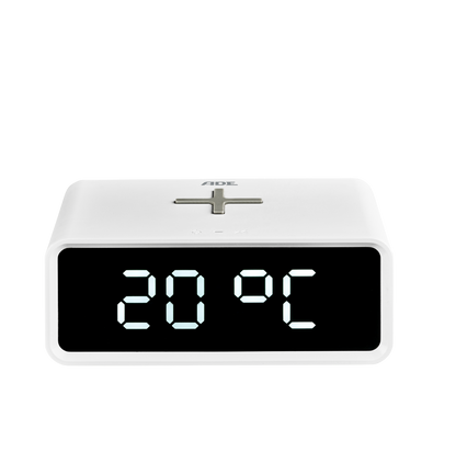 Digital alarm clock with induction charging pad