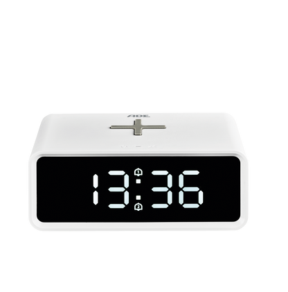 Digital alarm clock with induction charging pad